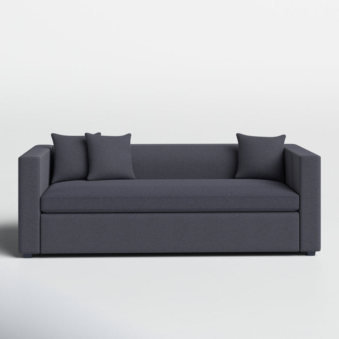 The Mono 81" Sleeper Sofa is a modern, minimalist piece with clean lines and square armrests. It comes with two matching cushions and is set against a plain white background, showcasing its sleek and contemporary design.