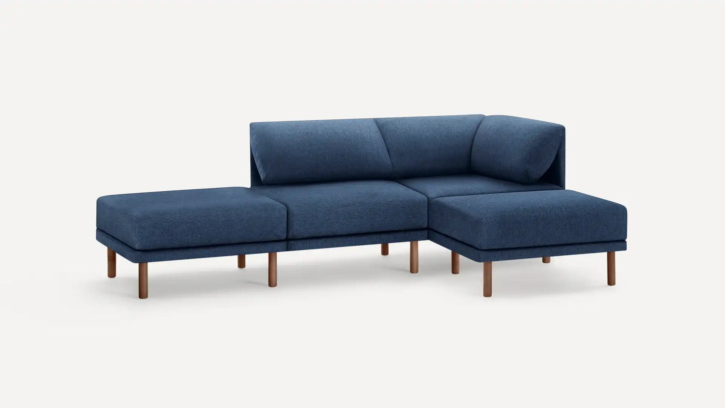 A contemporary and modular blue Range Fabric 4-Piece Open Sectional Double Lounger Sofa with a minimalist design. It includes four cushioned sections and elegant wooden legs, configured in an L-shape, set against a plain white background.