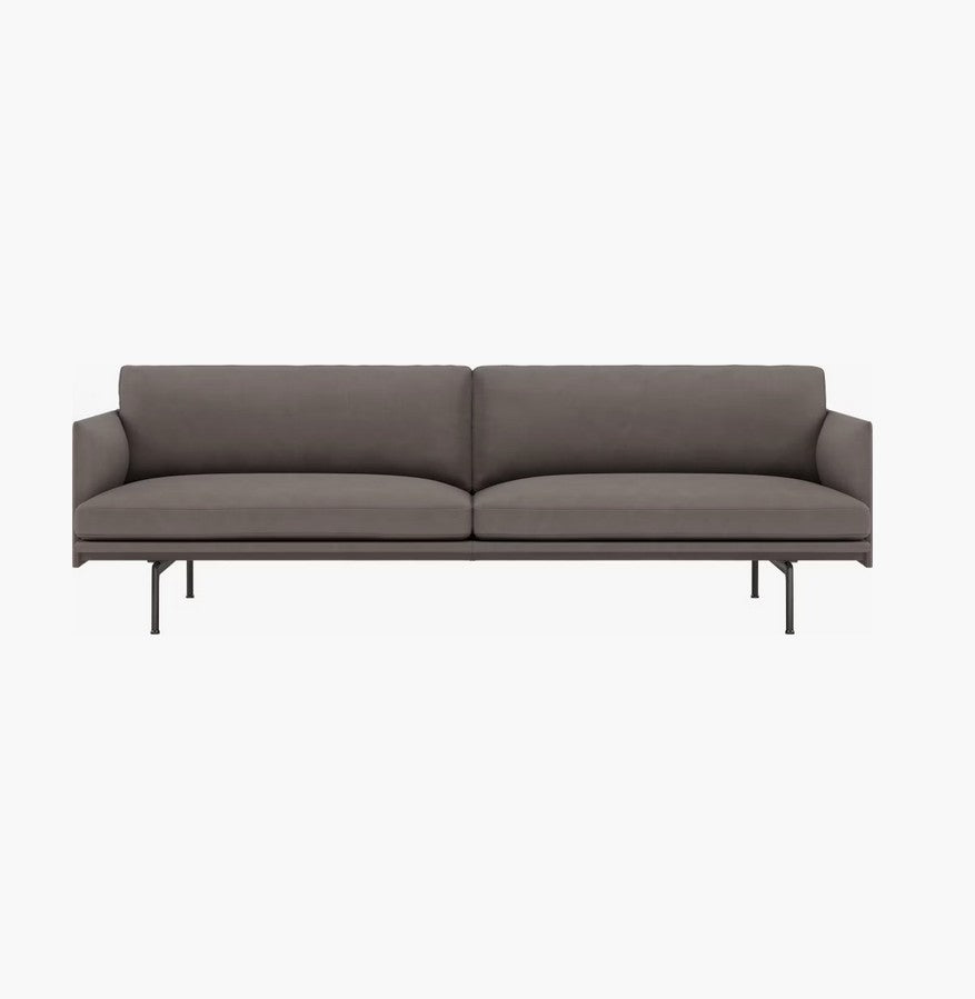 The Outline Sofa 3 Seater is a modern gray sofa boasting a sleek design with two seat cushions and a minimalist metal frame featuring thin legs. It includes a straight backrest and armrests, offering a contemporary appearance against a plain white background.