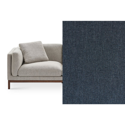 The Owen Chaise Sectional Sofa boasts a modern design with textured light gray fabric and includes a coordinating pillow. It features a wooden base, displayed from an angled front perspective. Beside it, there’s a close-up view of the dark gray textured fabric sample.