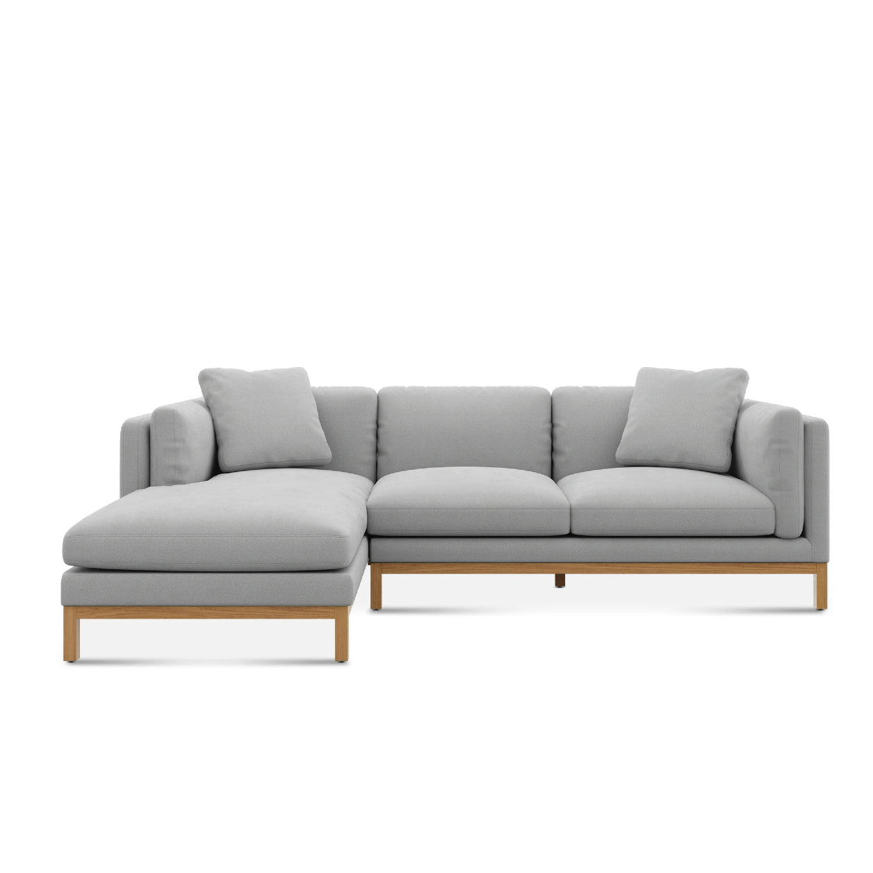 Introducing the Owen Chaise Sectional Sofa: a contemporary light gray L-shaped piece featuring a wooden frame. It comes with three seat cushions, two back cushions, and an integrated left-side chaise. The sofa boasts a minimalist design characterized by its clean lines.