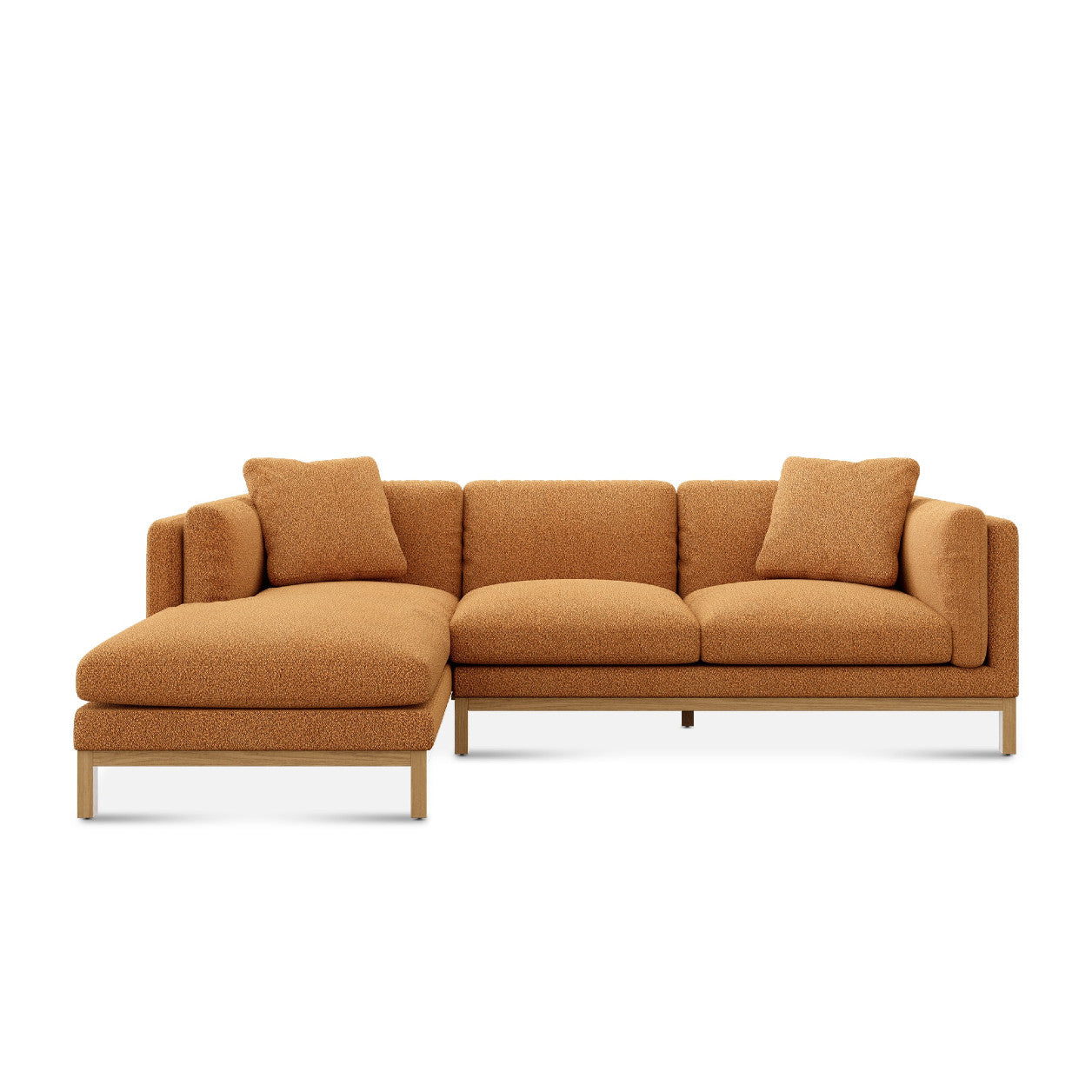 The Owen Chaise Sectional Sofa is a modern L-shaped piece crafted in a warm brown fabric. It showcases clean lines and includes two matching square pillows, all supported by a minimalist wooden frame for a contemporary aesthetic.