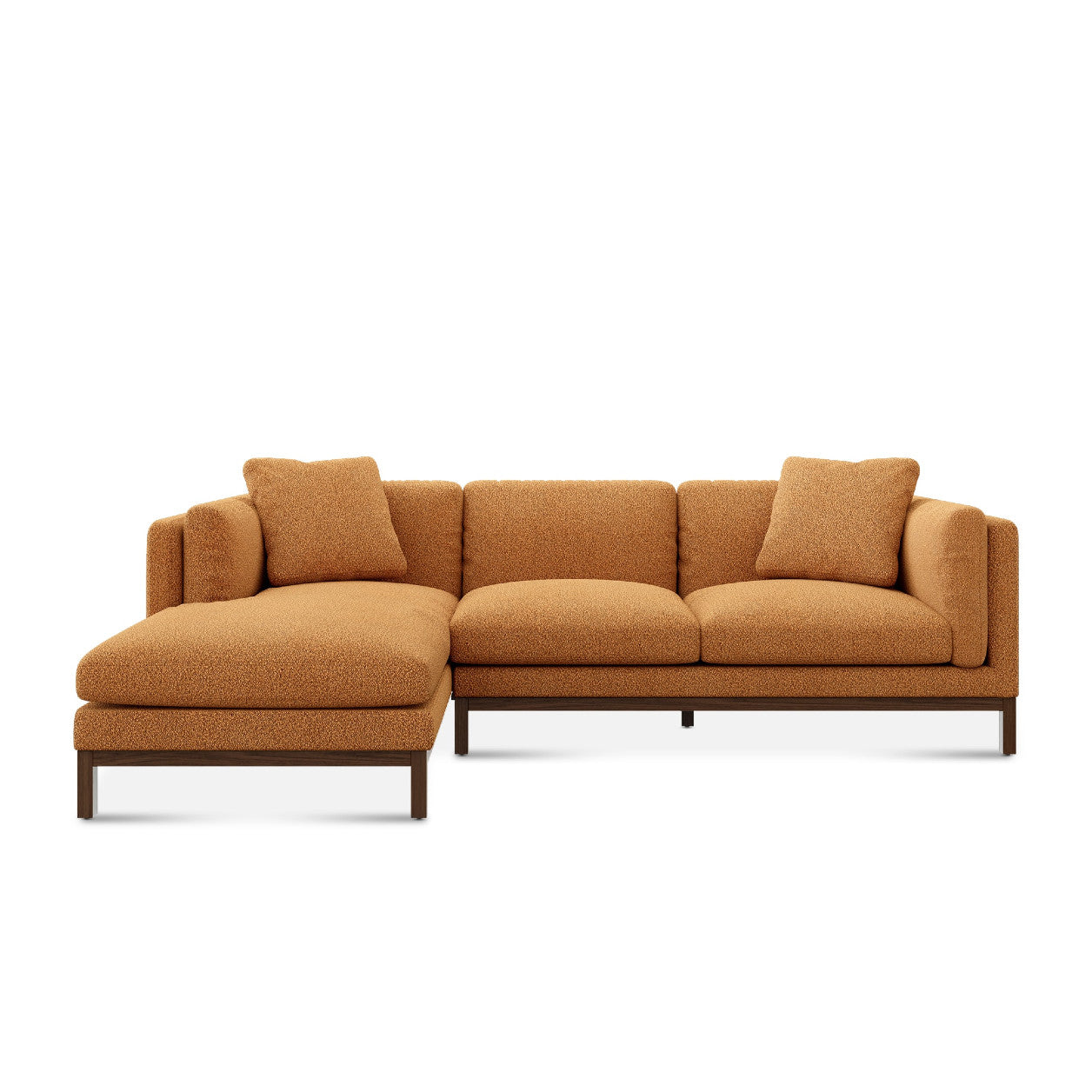 The Owen Chaise Sectional Sofa features a contemporary L-shaped design with warm brown textured fabric, accented by two matching cushions. It has a low back and is supported by a sleek, dark wooden frame.