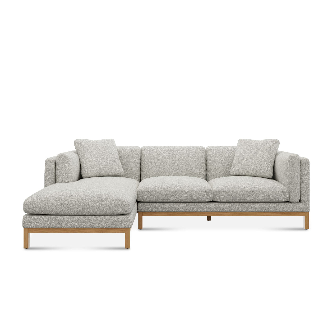 Introducing the Owen Chaise Sectional Sofa, a contemporary L-shaped piece with light gray upholstery and wooden legs. It boasts a left-side chaise and includes three back cushions, perfect for modern living spaces.