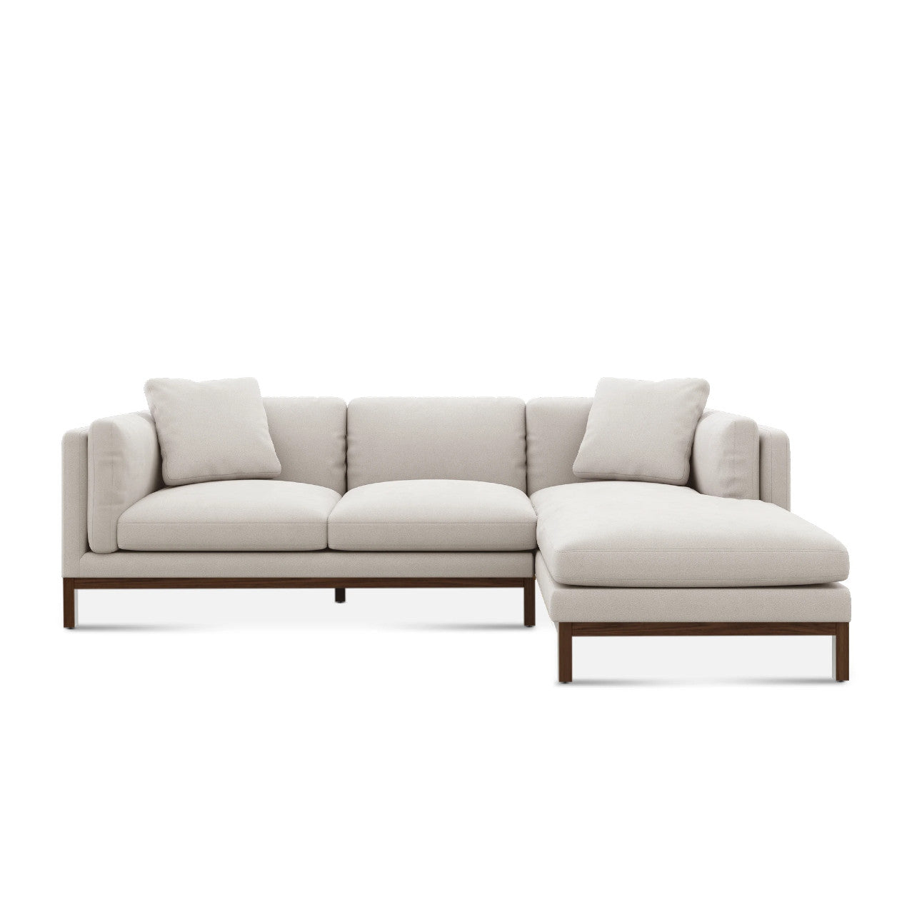 The Owen Chaise Sectional Sofa is a stylish and contemporary piece with a light gray hue, featuring a right-side chaise. It boasts clean lines, three seat cushions, and two back cushions, supported by a wooden base and frame against a plain white background.