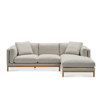 Introducing the Owen Chaise Sectional Sofa: a contemporary light grey sectional with stylish wooden legs. This modern piece includes a right-side chaise section and comes with two coordinating cushions.