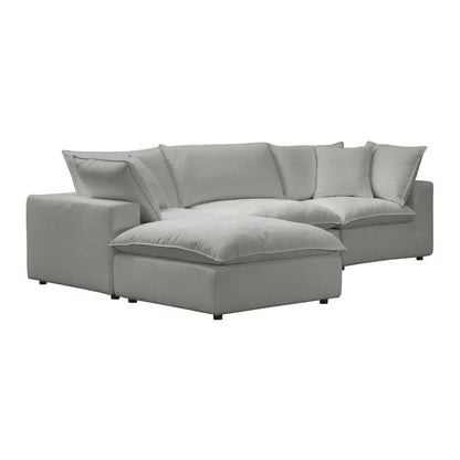 The Cali Performance Fabric Modular 4 Piece Sectional is a contemporary light gray sofa featuring plush cushions and a minimalist design. It includes a chaise lounge on one side for added comfort and style, resting on sleek, black legs.