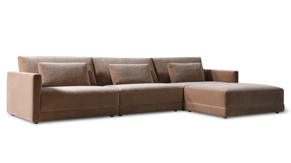 The Wind Down 4-Piece Modular Sectional is a brown velvet L-shaped sofa, offering three seats with three matching cushions and an extended chaise lounge on the right side. It boasts a modern, minimalist look set against a white background.