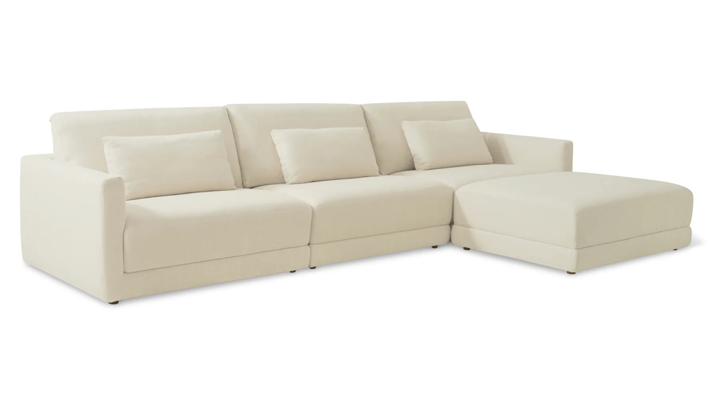 Introducing the Wind Down 4-Piece Modular Sectional, a spacious off-white sectional sofa complete with three seats and a right-side chaise. It includes three back cushions and two smaller rectangular accent pillows, offering a cozy yet modern aesthetic against a clean white backdrop.