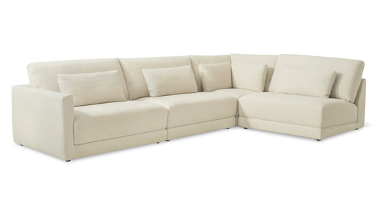 Introducing the Wind Down 4-Piece Modular Sectional: A modern, cream-colored L-shaped sectional sofa featuring plush cushions on the backrest and sides. Designed with a minimalist aesthetic, it is upholstered in a smooth fabric and sits on small, dark round legs.