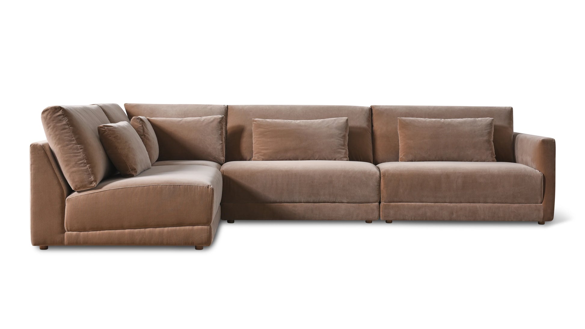 The Wind Down 4-Piece Modular Sectional, featuring a plush brown finish, is styled in an L-shape against a white background. This roomy sectional includes three spacious seats and comes with four coordinating cushions. Its soft fabric lends a cozy and welcoming look.