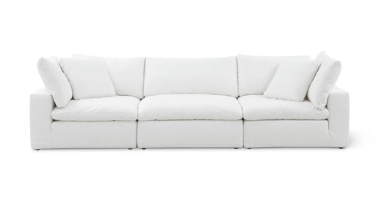 The Movie Night 3-Piece Modular Sofa is a modern white sofa with plush cushions, featuring three sections. Its clean lines and minimalist design offer a cozy yet stylish look, perfect for contemporary living spaces.