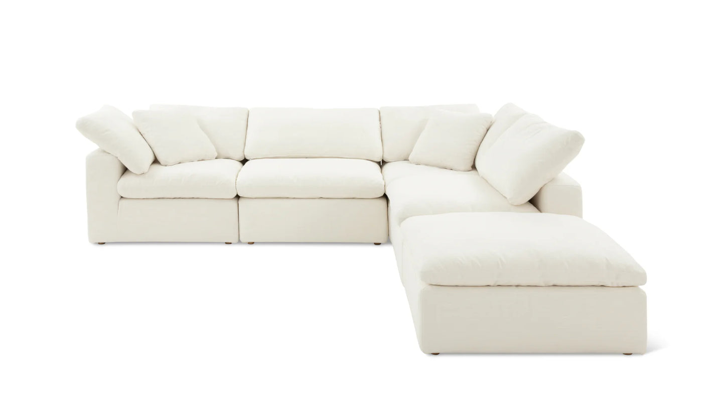 The Movie Night 3-Piece Modular Sofa is a spacious, cream-colored sectional with a contemporary design. It includes three main seating sections and an extended chaise on the right, all equipped with plush cushions. The sofa is displayed against a plain white background.