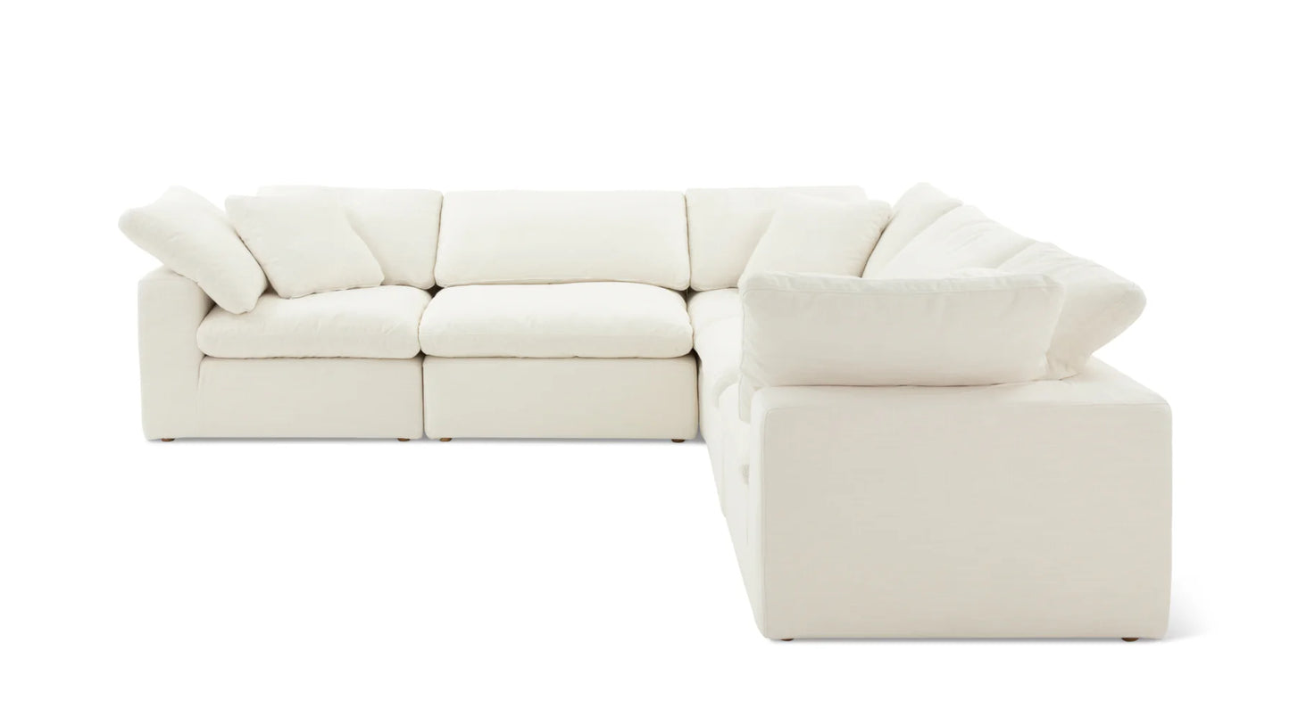 The Movie Night 3-Piece Modular Sofa is a spacious L-shaped white sectional, featuring plush cushions and a sleek modern design, displayed against a plain white background.