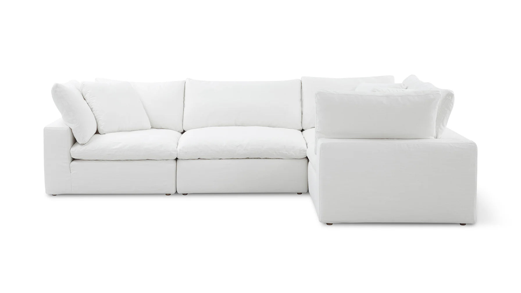 The Movie Night 3-Piece Modular Sofa is a white sectional with plush cushions arranged in an L-shape formation against a simple backdrop. It offers comfort and spaciousness, perfectly designed for a modern living room setting.