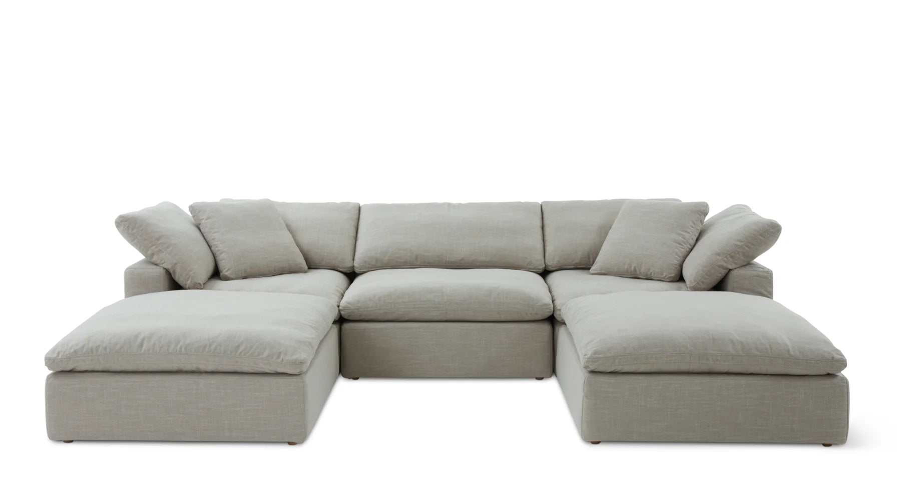 The Movie Night 3-Piece Modular Sofa is a spacious, light gray sectional with plush cushions and several seating sections, featuring chaise lounges on each end, set against a simple white background.