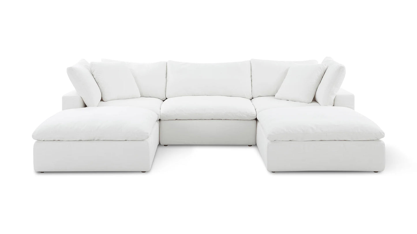 Introducing the "Movie Night 3-Piece Modular Sofa," a sumptuous white sectional with a chaise on each end. It features plush cushioned seats and backrests, complemented by four large cushion pillows, all showcased against a plain white background.