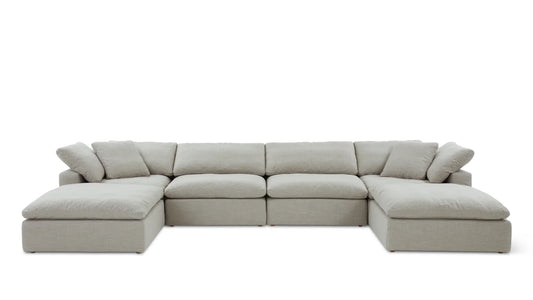 The Movie Night 3-Piece Modular Sofa is a large, light gray sectional with an L-shaped configuration. It features plush cushions and wide armrests, designed for comfort and spacious seating, set against a plain white background.