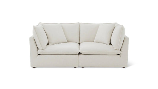 Against a plain white background, there is the Chill Time 4-Piece Modular Sectional in light beige, featuring space for two with its high back cushions and square armrests.