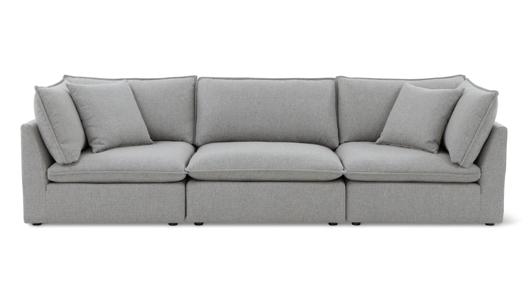 The Chill Time 4-Piece Modular Sectional, featuring a modern gray design with three seating cushions and five plush back cushions, is displayed against a white background. Its minimalist design offers a clean and elegant appearance.