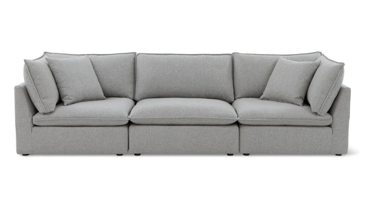 The Chill Time 4-Piece Modular Sectional, featuring a modern gray design with three seating cushions and five plush back cushions, is displayed against a white background. Its minimalist design offers a clean and elegant appearance.