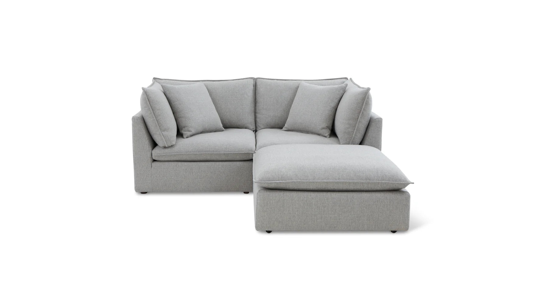 Introducing the Chill Time 4-Piece Modular Sectional: a contemporary grey sectional sofa featuring a right chaise lounge. It boasts clean lines, plush cushions, and a minimalist design, all showcased against a simple white backdrop.