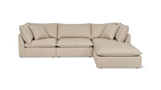 The Chill Time 4-Piece Modular Sectional is a beige L-shaped sofa featuring cushioned seats and backrests. It includes several matching throw pillows and has a right-side chaise lounge, all set against a plain white background.