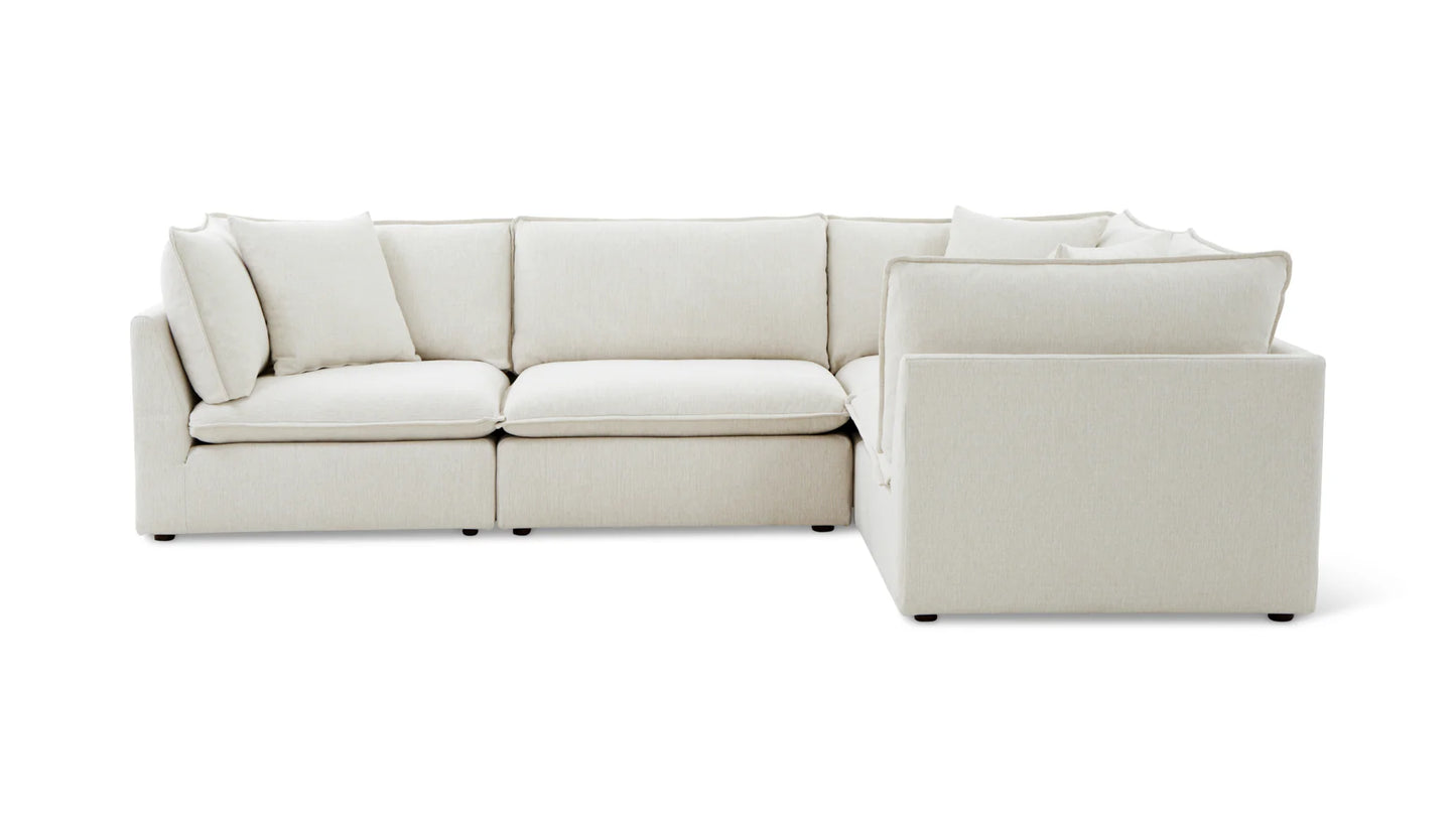 The Chill Time 4-Piece Modular Sectional features a modern design with thick cushions in a beige color and an L-shape configuration, offering generous seating space against a white backdrop.