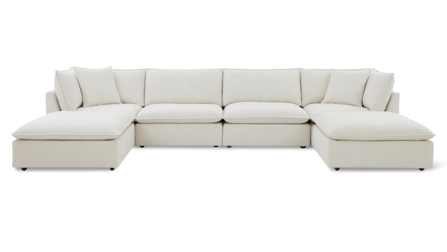 The Chill Time 4-Piece Modular Sectional is a spacious, white, L-shaped sofa featuring several cushions. Set against a plain white background, the sectional's sleek lines and contemporary design stand out prominently. It offers comfortable, wide seating with a minimalist aesthetic.