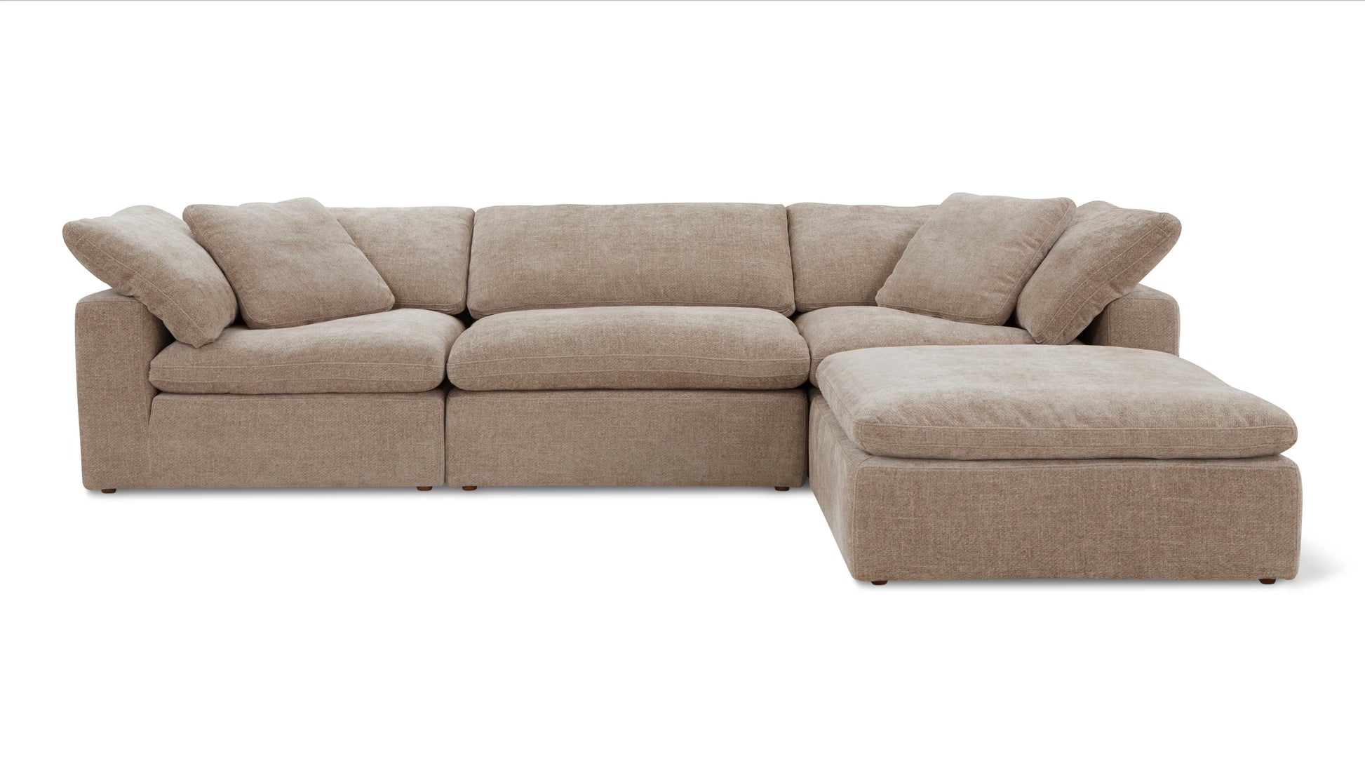 A Movie Night 3-Piece Modular Sofa in beige, complete with plump cushions and featuring a right-side chaise lounge, is set against a plain white background.