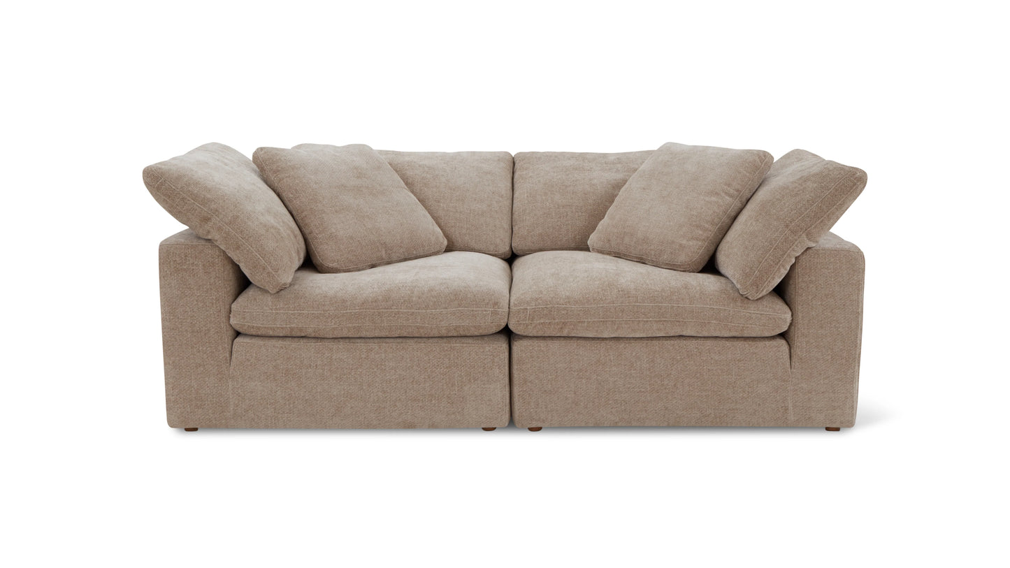 A beige, plush three-piece modular sofa with detachable cushions on both the seat and backrest, set against a plain white background.