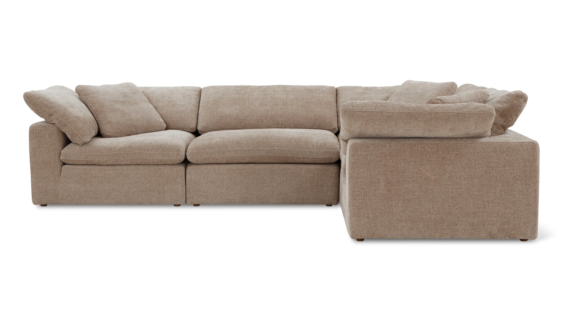 The Movie Night 3-Piece Modular Sofa is a beige sectional with a clean, minimalist design. Its L-shaped arrangement includes plush cushions and textured fabric, providing a cozy and modern seating option in a neutral color.