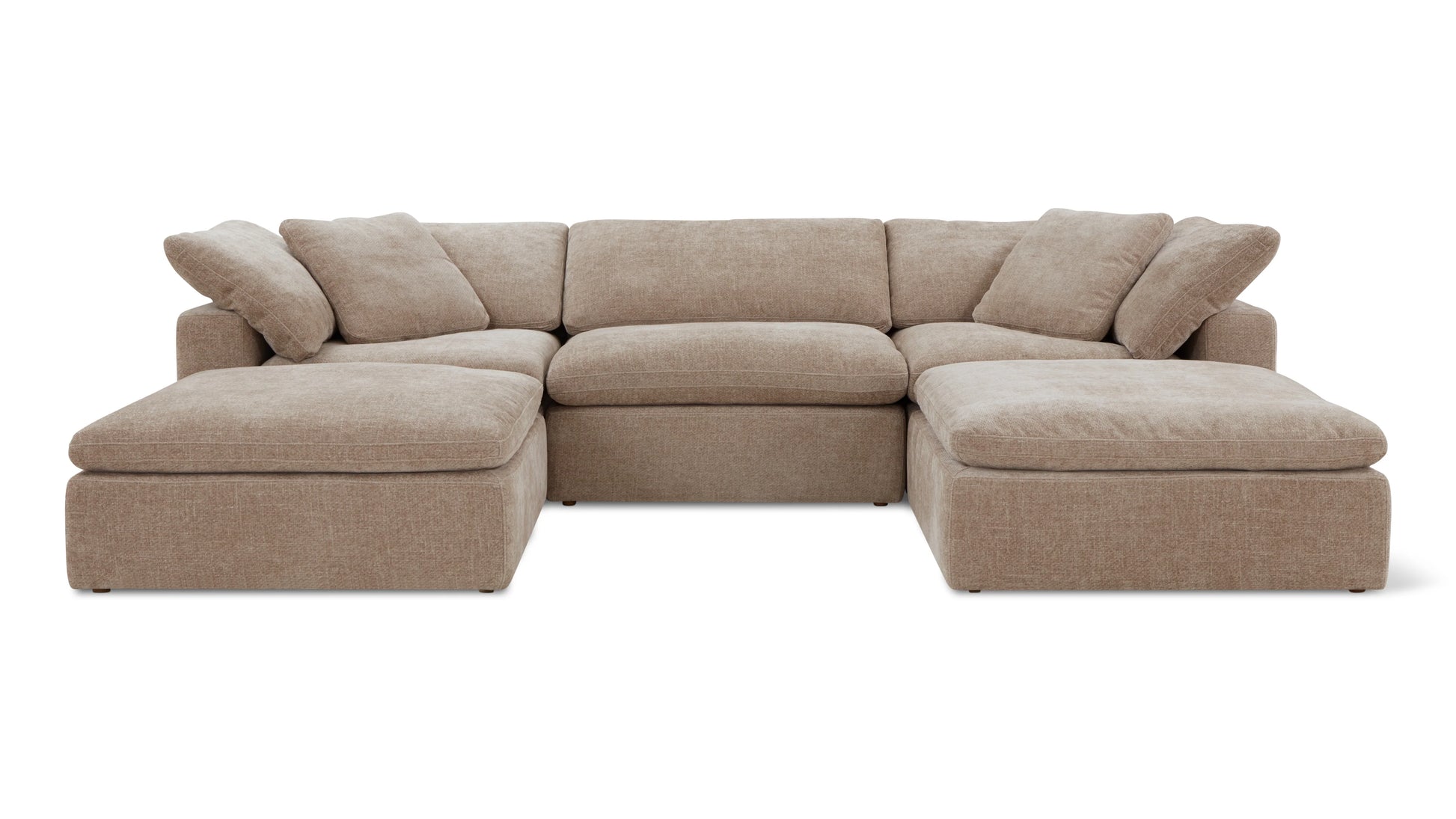 The Movie Night 3-Piece Modular Sofa is a spacious, light brown sectional with plush cushions and chaise lounges on either end. It boasts thick armrests and a textured fabric, arranged in an L-shape perfect for a modern living room.