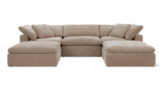 The Movie Night 3-Piece Modular Sofa is a spacious, light brown sectional with plush cushions and chaise lounges on either end. It boasts thick armrests and a textured fabric, arranged in an L-shape perfect for a modern living room.