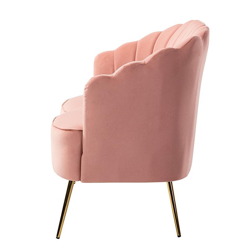 A side view of the Ariel Scalloped Loveseat reveals its elegant pink velvet upholstery, scalloped edges, and gold metal legs. The design is modern and stylish, making it a perfect choice for contemporary interiors.