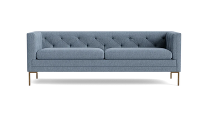 The Sit Tight 90" Sofa features a contemporary gray design with a tufted backrest and slim metal legs, set against a black background. It includes two large seat cushions and boasts a sleek, minimalist style.