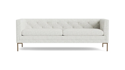 The Sit Tight 90" Sofa, featuring a white tufted design with two seat cushions and wooden legs, is displayed against a plain black background.