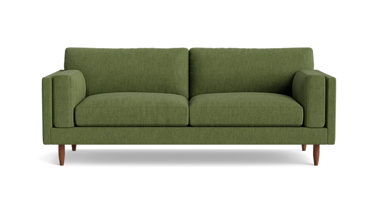 The Skinny Fat 85" Sofa Standard Depth is showcased against a white background. This green tufted loveseat includes two seat cushions and two back cushions, complemented by wooden legs that enhance its sleek modern design.