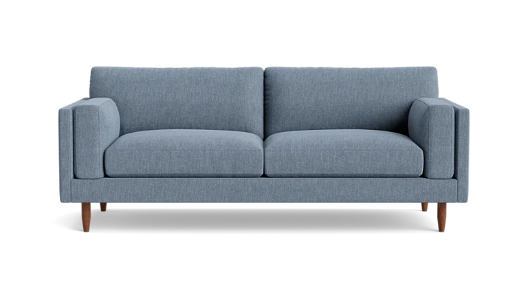 Presenting the Skinny Fat 85" Sofa Standard Depth: a contemporary two-seater with light blue upholstery and wooden legs, viewed from the front. It features clean lines and plush cushions, embodying a minimalist design.