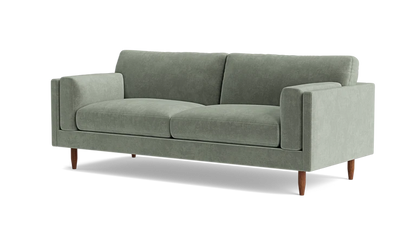 Introducing the Skinny Fat 85" Sofa Standard Depth—a sleek and contemporary sofa in a modern light green hue. This stylish piece includes two seat cushions and two back cushions, complemented by straight armrests and supported by four wooden legs.