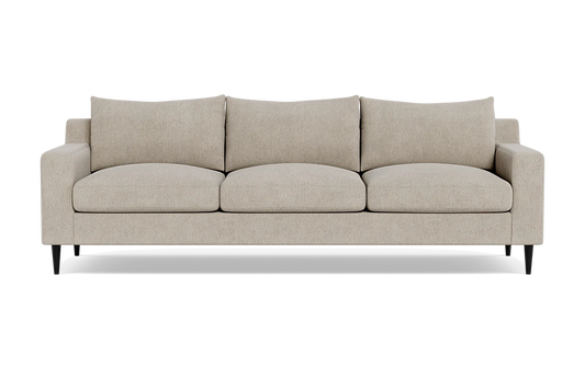 The Sloan Custom 3-Seat 95" Sofa, in beige, showcases a minimalist design with rectangular cushions and armrests. This three-seater sofa is supported by dark wooden legs and is highlighted against a simple backdrop.