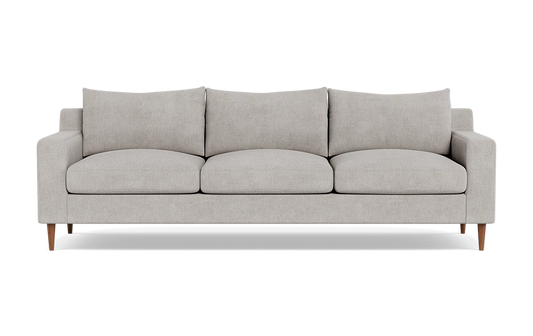 The Sloan Custom 3-Seat 95" Sofa features a modern design with a light gray finish, encompassing three seat cushions and three back cushions. Its clean, simple lines and wooden legs contribute to its minimalist and stylish look. The sofa is presented against a plain black background.