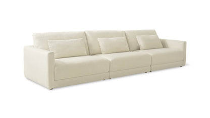 The Wind Down 4-Piece Modular Sectional in a light beige color features a spacious design with three cushioned seats and matching removable back pillows set against a white background. It has a low profile and is equipped with square armrests.