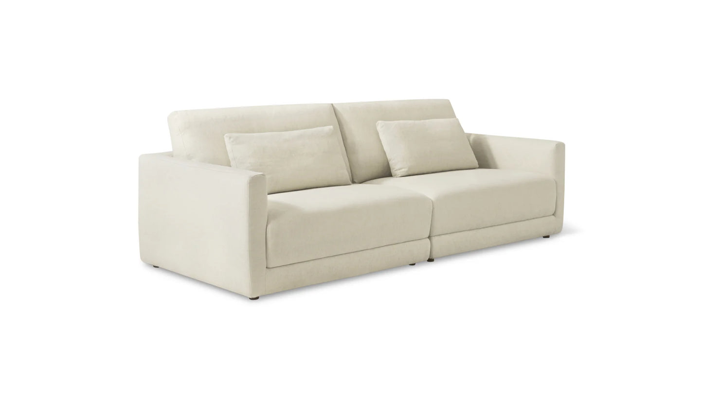 A contemporary beige Wind Down 4-Piece Modular Sectional featuring straight arms and two matching cushions. This sectional embodies a clean, minimalist design and is showcased against a plain white background.