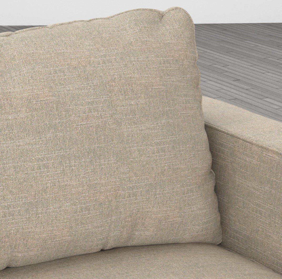 Close-up of a Sactionals - 4 Seats + 5 Sides Sactional Beachwood Rained Chenille, showcasing its textured beige fabric. The focus is on the cushioned backrest and armrest, highlighting its simple, modern design against a wooden floor backdrop.