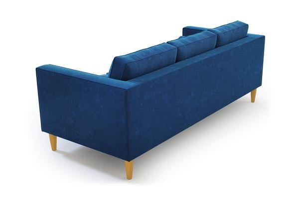 The Samson Sofa, with its blue upholstery and three back cushions, is shown from behind. It boasts clean lines and light wooden legs, providing a modern aesthetic.