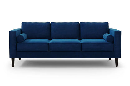 The Samson Sofa is a contemporary piece featuring a modern blue design with three seat cushions and two cylindrical armrest pillows. Its sleek, straight lines and dark wooden legs stand out beautifully against a plain white background.