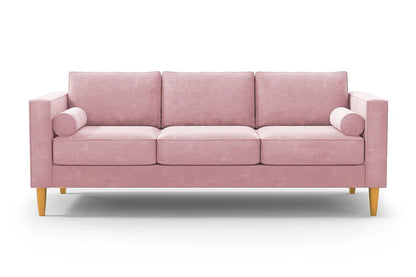 The Samson Sofa is a pink, modern three-seater featuring rectangular cushions and two cylindrical bolster pillows, complemented by wooden legs against a white background.