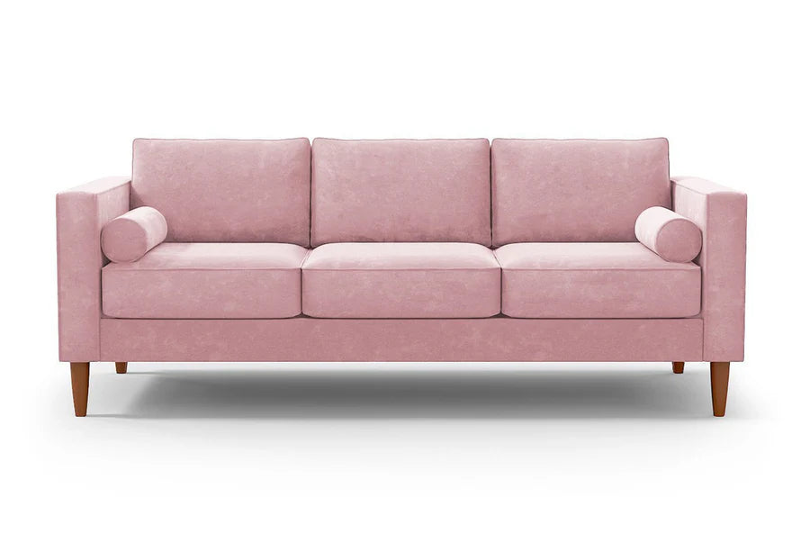 Introducing the Samson Sofa: a stylish pink three-seater featuring three cushions and two cylindrical arm pillows. It boasts wooden legs and a modern, minimalist design, all set against a plain white background.