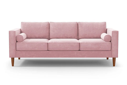 Introducing the Samson Sofa: a stylish pink three-seater featuring three cushions and two cylindrical arm pillows. It boasts wooden legs and a modern, minimalist design, all set against a plain white background.